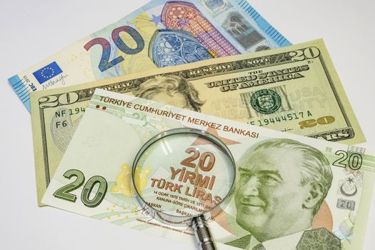 close up turkish lira, american dollar and euro banknotes on background