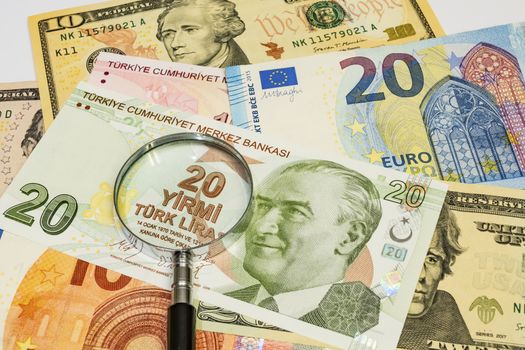 close up turkish lira, american dollar and euro banknotes on background