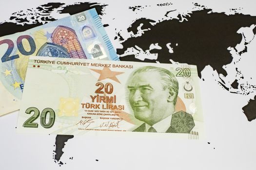 close up turkish lira banknotes with euro bankmotes on background