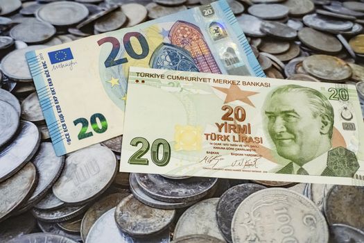 close up turkish lira banknotes with euro bankmotes on background