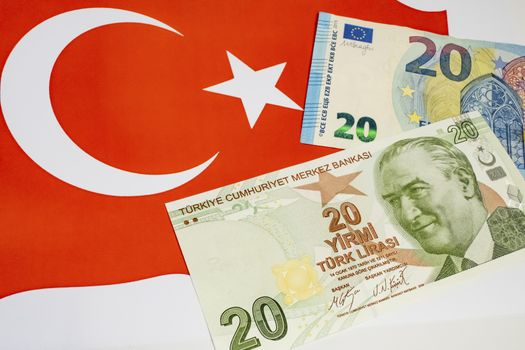 close up turkish lira banknotes with euro bankmotes on background