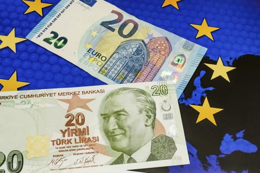 close up turkish lira banknotes with euro bankmotes on background