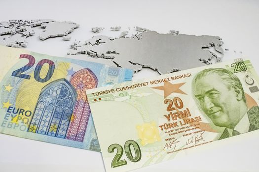 close up turkish lira banknotes with euro bankmotes on background