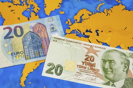 close up turkish lira banknotes with euro bankmotes on background