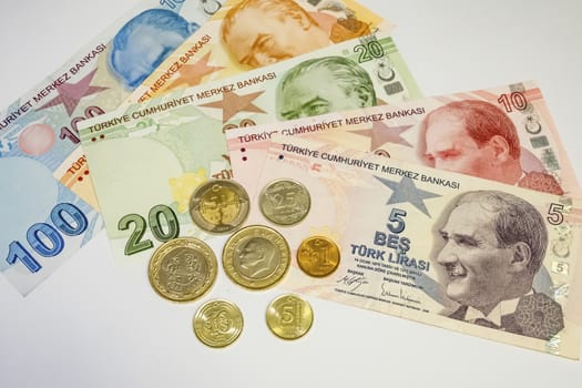 close up turkish lira banknotes with turkish metal coins on background