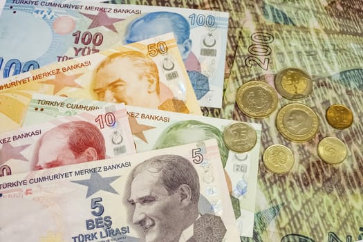 close up turkish lira banknotes with turkish metal coins on background