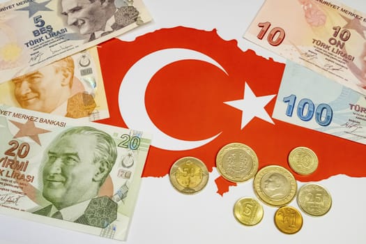 close up turkish lira banknotes with turkish metal coins on background