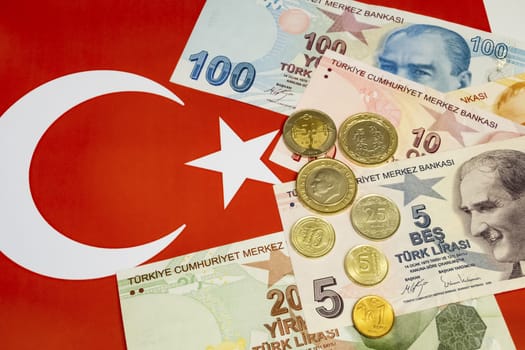 close up turkish lira banknotes with turkish metal coins on background
