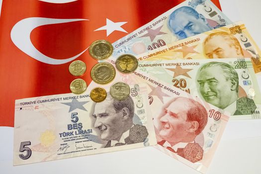 close up turkish lira banknotes with turkish metal coins on background