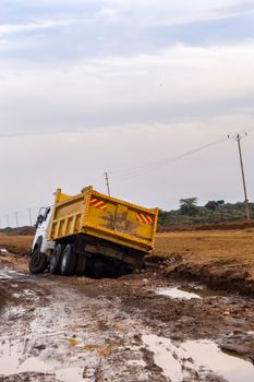 Truck stuck. The rear wheels are muddy. Mud road in the rift valley in Kenya