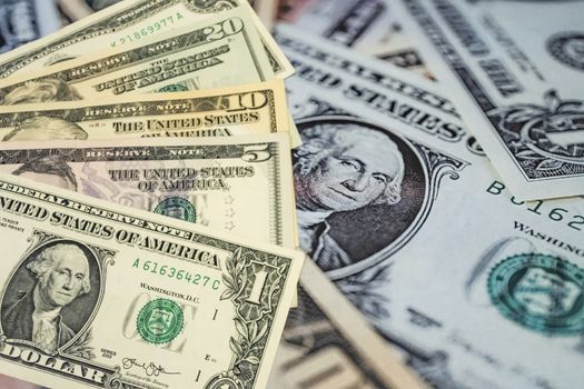 close up US dollar banknotes on background.
