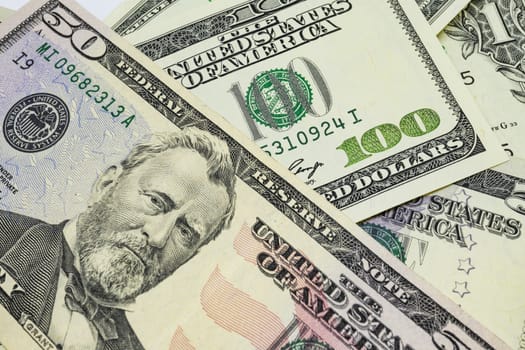 close up US dollar banknotes on background.