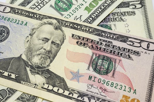 close up US dollar banknotes on background.
