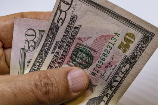 close up US dollar banknotes on background.