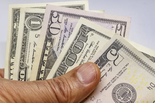 close up US dollar banknotes on background.