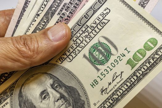 close up US dollar banknotes on background.