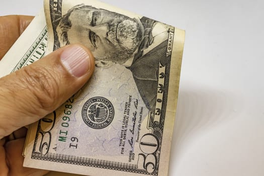 close up US dollar banknotes on background.
