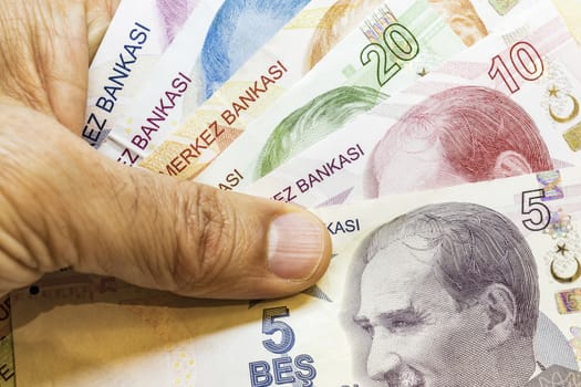 close up turkish lira banknotes on background