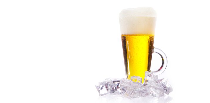 fresh cold beer with ice and foam and water drops