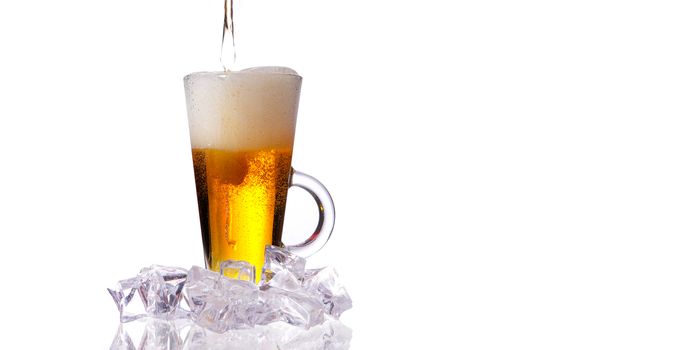 fresh cold beer with ice and foam on white background