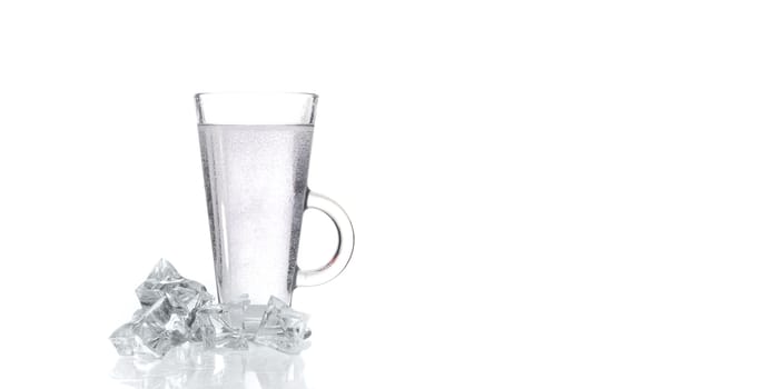 glass of fresh clear water with ice on white background