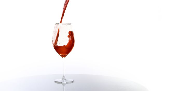 Pour yourself a glass of wine on white background