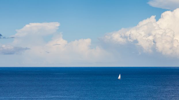 An isolated yacht sails off the coast of La Palma the Spanish Canary island.