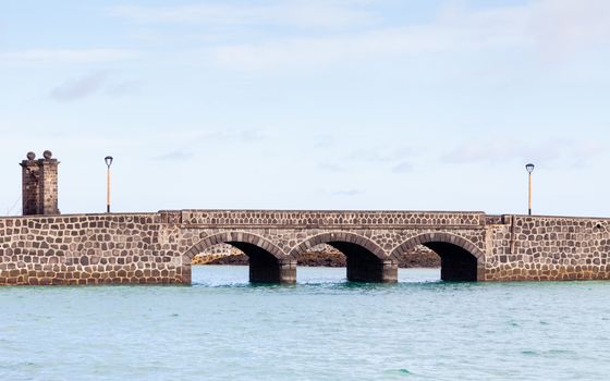 Puente de las Bolas leads to San Gabriel Castle in the port city of Arrecife on the Spanish island of Lanzarote.