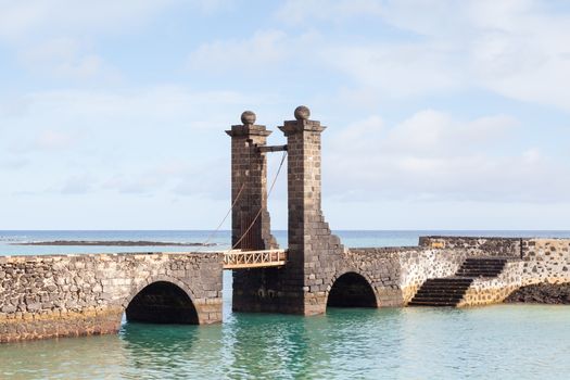 Puente de las Bolas leads to San Gabriel Castle in the port city of Arrecife on the Spanish island of Lanzarote.