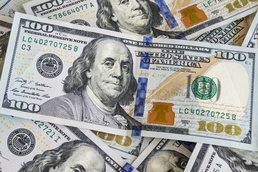 close up US dollar banknotes on background.