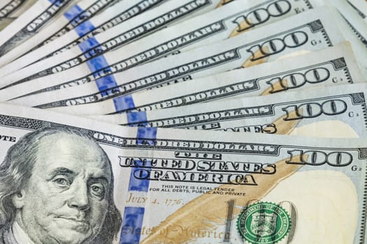 close up US dollar banknotes on background.
