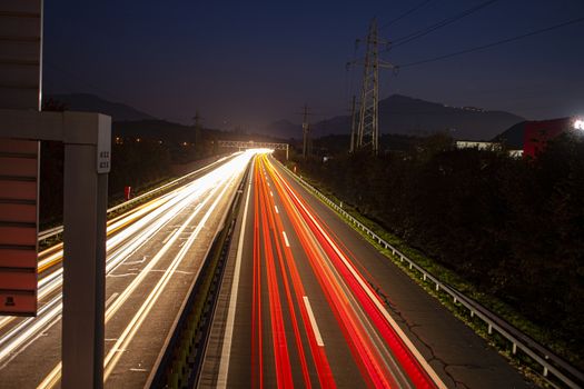 head and back lights with long exposure causing long light streaks. Long exposure