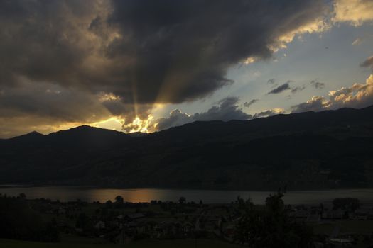 sunset in the mountains. With lake Sarnen, Switzerland with dramatic clouds