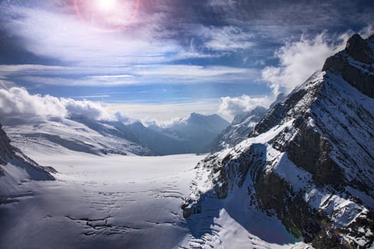 Three famous Swiss mountain peaks, Eiger, Mönch and Jungfrau. With clouds and snow