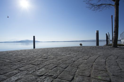 peaceful day on the pier on lake zug, switzerland. Lakefront Zug