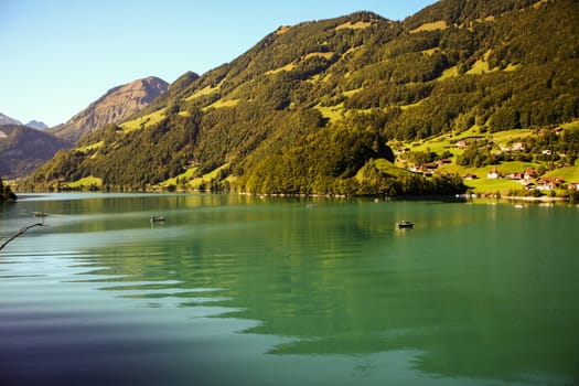 lake lungern Switzerland - famous fishing lake in Switzerland. Reflection in water