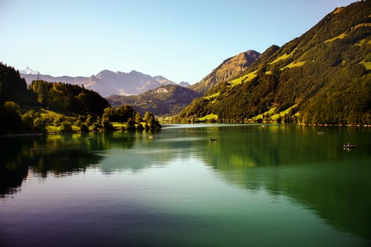 lake lungern Switzerland - famous fishing lake in Switzerland. Reflection in water