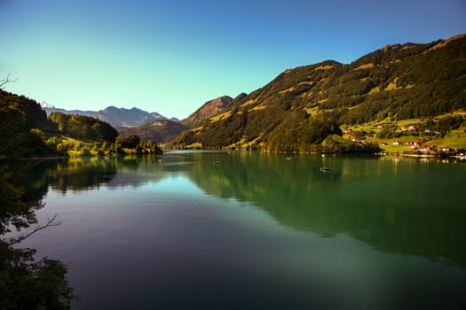 lake lungern Switzerland - famous fishing lake in Switzerland.Reflection in water