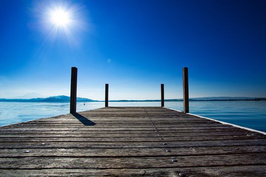 peaceful day on the pier on lake zug, switzerland. Lakefront and pier in Zug