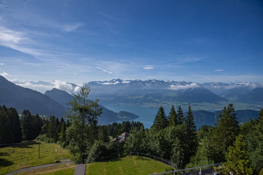 Swiss Alps landscape up in rigi Kalrtbad, with trees, mountains and blue sky