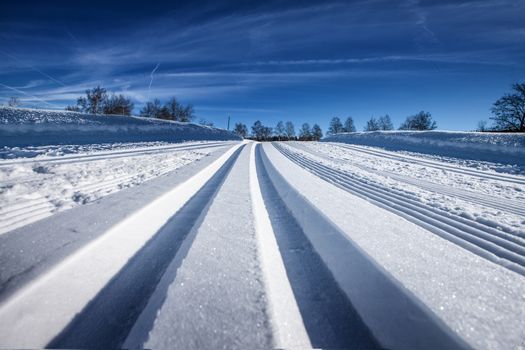 cross country tracks in swiss alps. Clean tracks in Snow