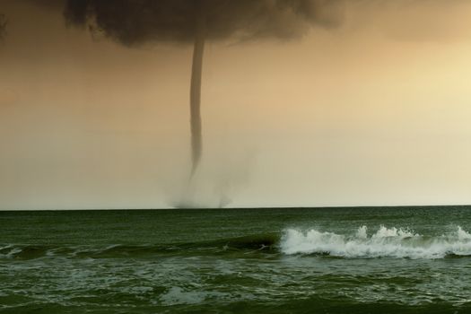 bad weather and storm with the wind on the sea. tornado over the ocean, nature force background - huge tornado, bright lightning in dark stormy sky