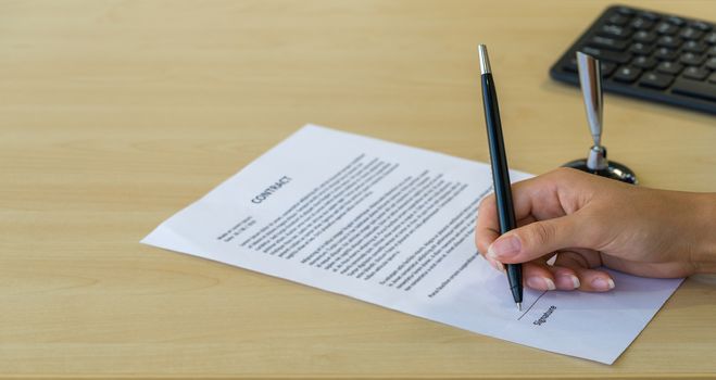 Job interviewers put a sign on the contract after being considered by the HR department.