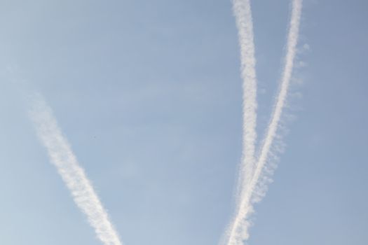 jet fuel trail left by planes at the sky