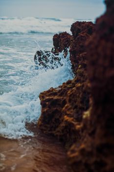 Storm in the ocean, sea waves crashing on rocks on the beach coast, nature and waterscape scenery