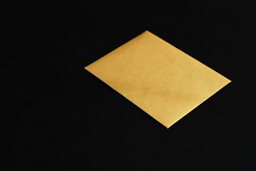 Blank golden paper card on black background,  premium business and luxury brand identity mockup