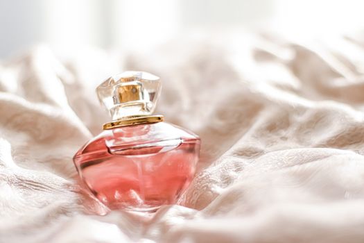 Perfume bottle with aromatic floral scent, luxury fragrance for women