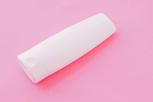 Moisturizing hand cream or body lotion on pink background, beauty product and skin care cosmetics, flatlay