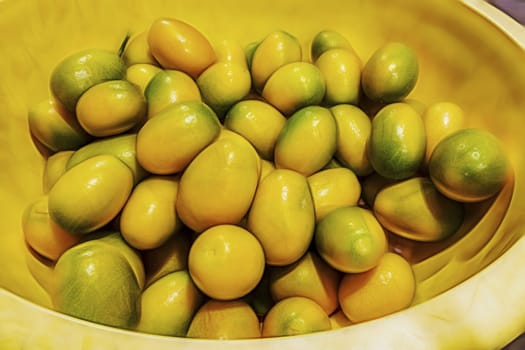 close up kumquat fruits on background
