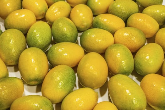 close up kumquat fruits on background